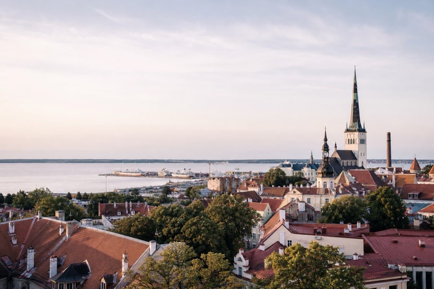 Tallinn old town rooftops and Baltic Sea harbor in soft Nordic daylight, Estonia
