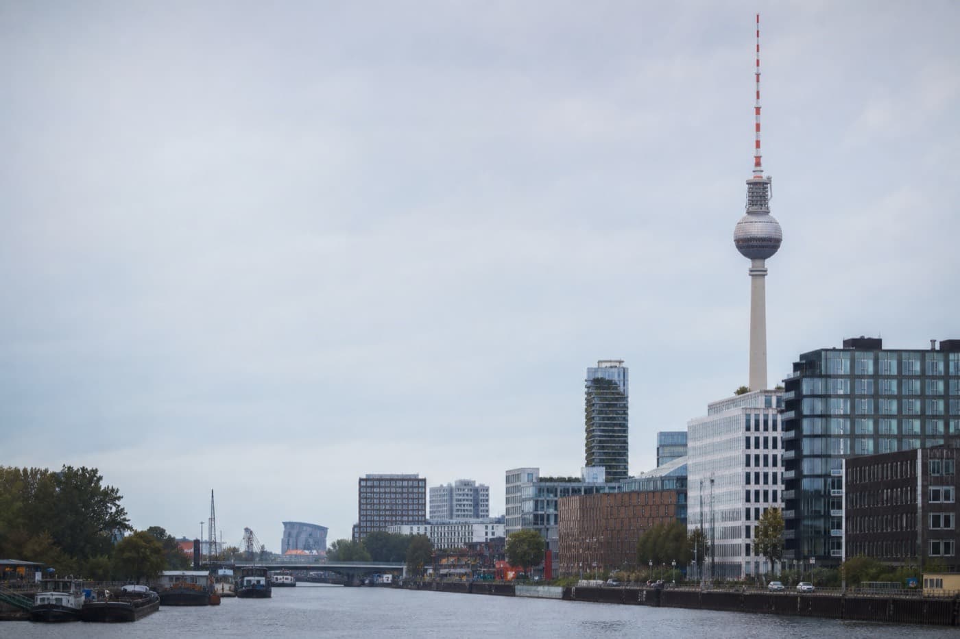 Berlin riverfront with modern and historic architecture under overcast light, Germany