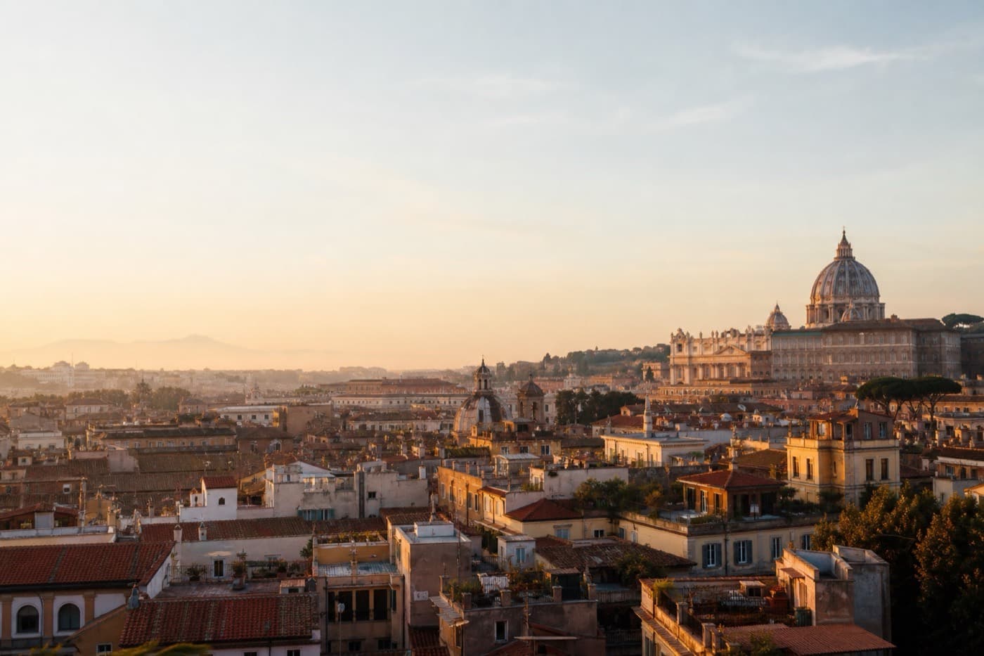 Florence riverfront with terracotta rooftops and Tuscan hills, Italy